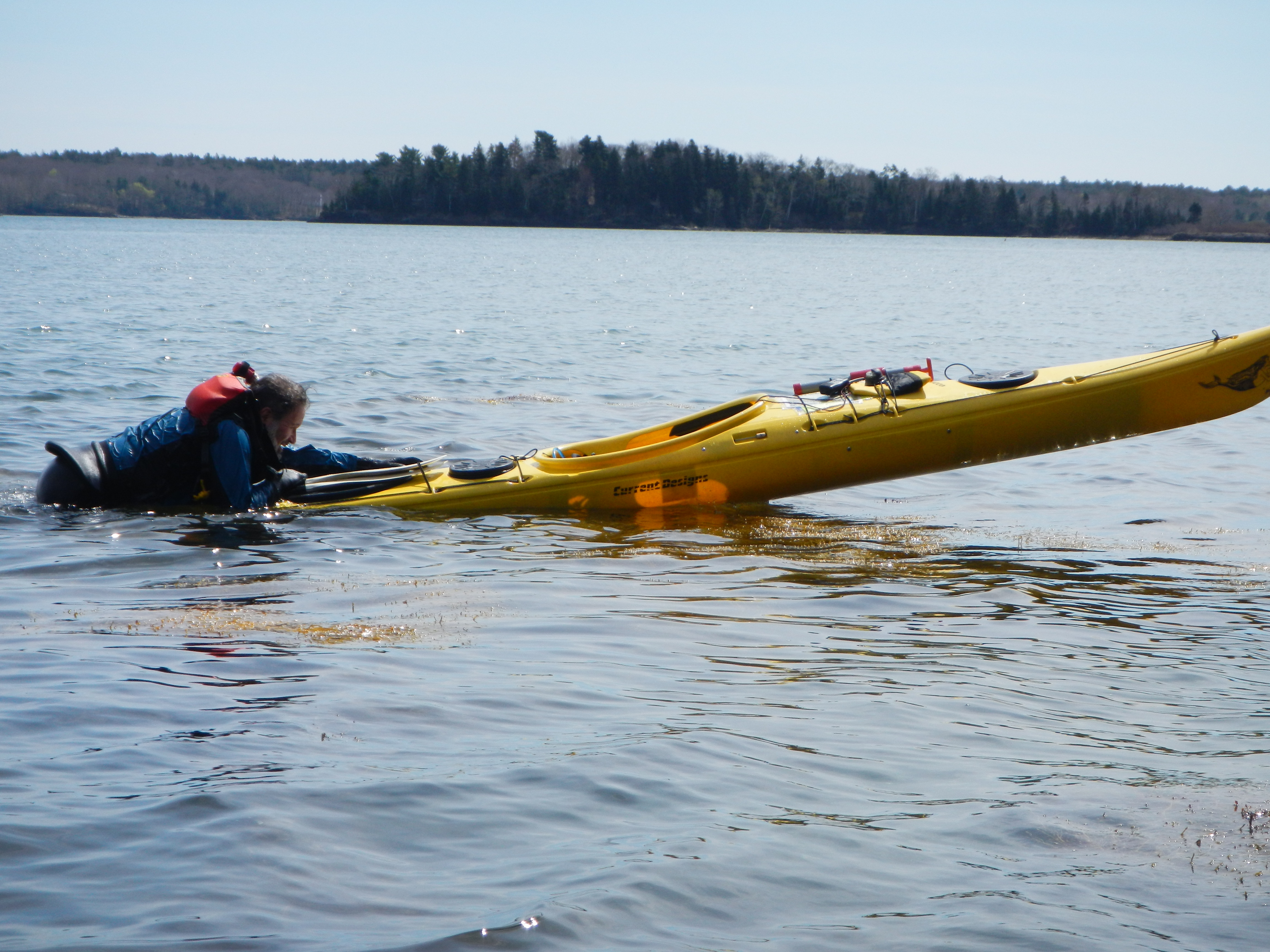 Trying to get into a sea kayak without a paddle